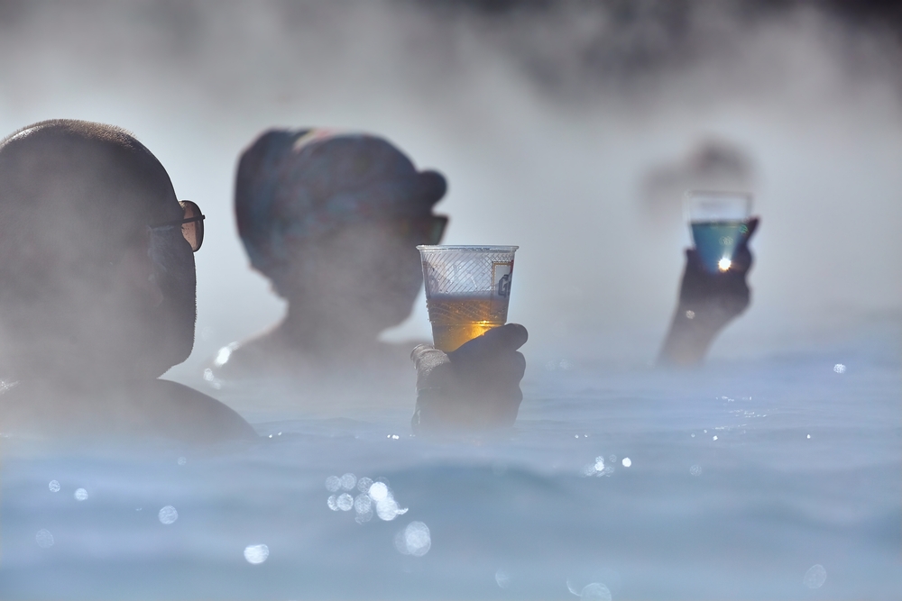 Blue lagoon. People having a drink at the Blue Lagoon in Iceland.