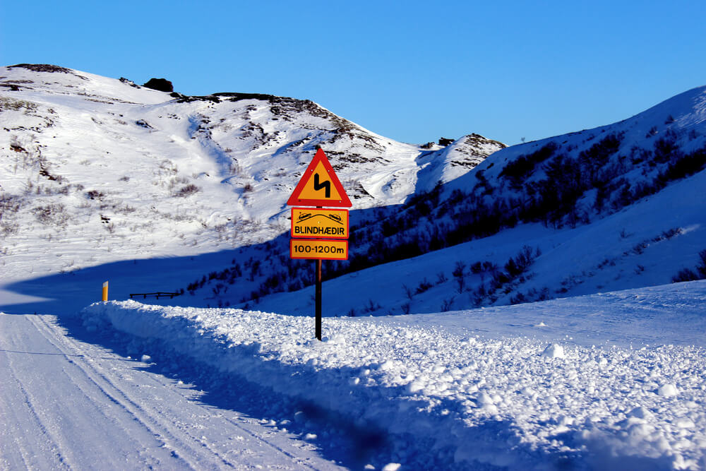 Road sign Iceland winter. Iceland sign on in winter.