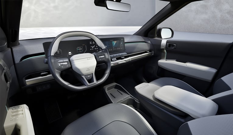 Kia Ev3 interior steering wheel and infotainment system.