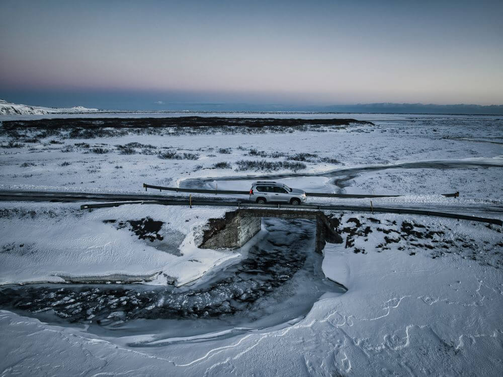 4x4 in Iceland crossing a bridge in winter