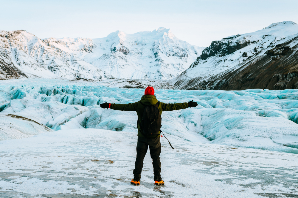 Sólheimajökull Glacier. Man standing in front of a Sólheimajökull glacier in Iceland.