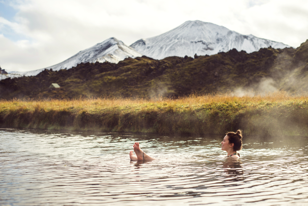 Hot pool in Landmannalaugar. Women sitting in the hot geothermal pool in Landmannalaugar.