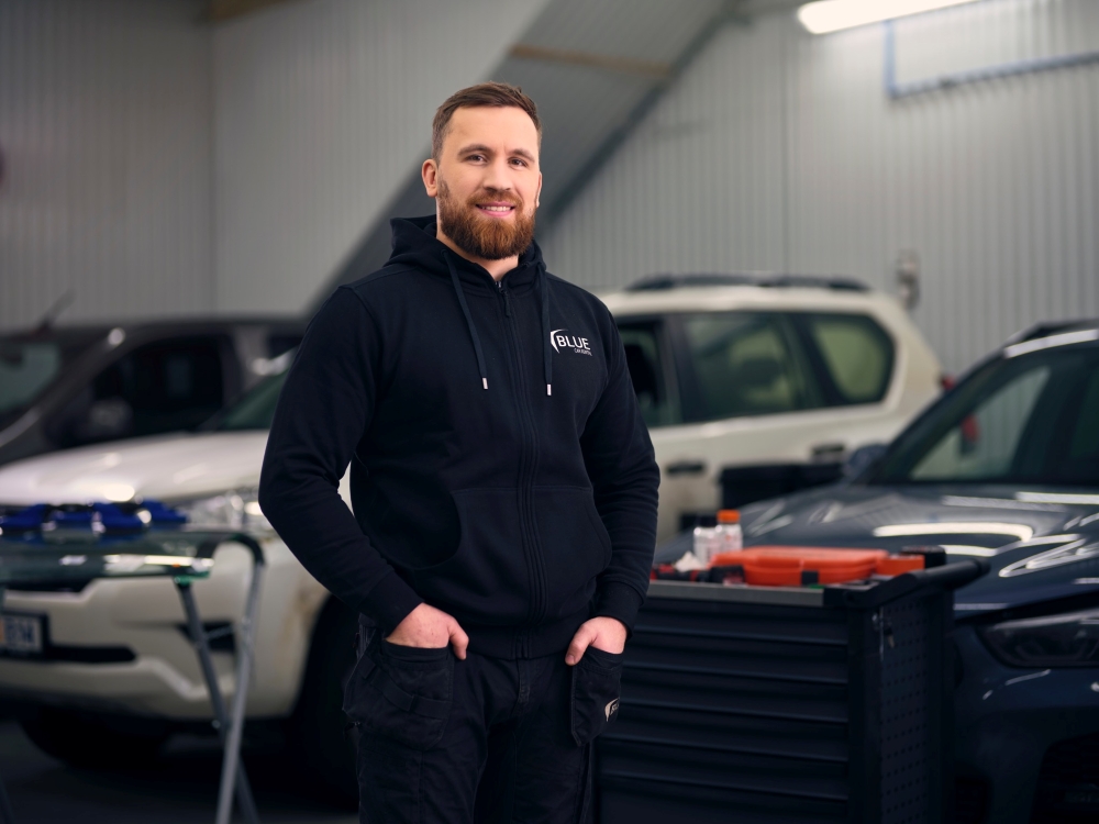 Blue Car Rental garage. Blue car rental local staff member at the garage in Keflavik.