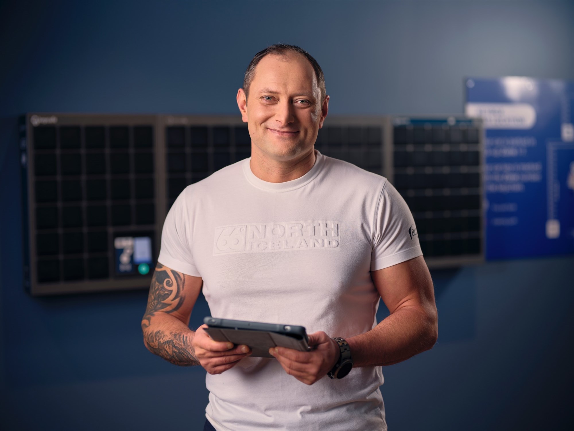 Best service blue car rental. Blue Car Rental staff member smiling in the key-box pick up.