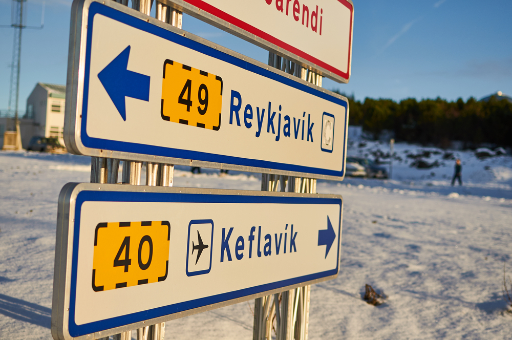 Keflavik and Reykjavik airport sign. Street sign with directions to Keflavik airport and Reykjavik airport in Iceland.