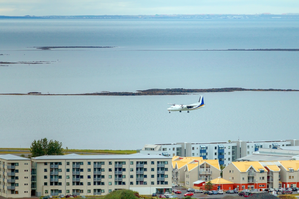 Reykjavik airport. Small airplane flying over Reykjavik to lend at Reykjavik airport.