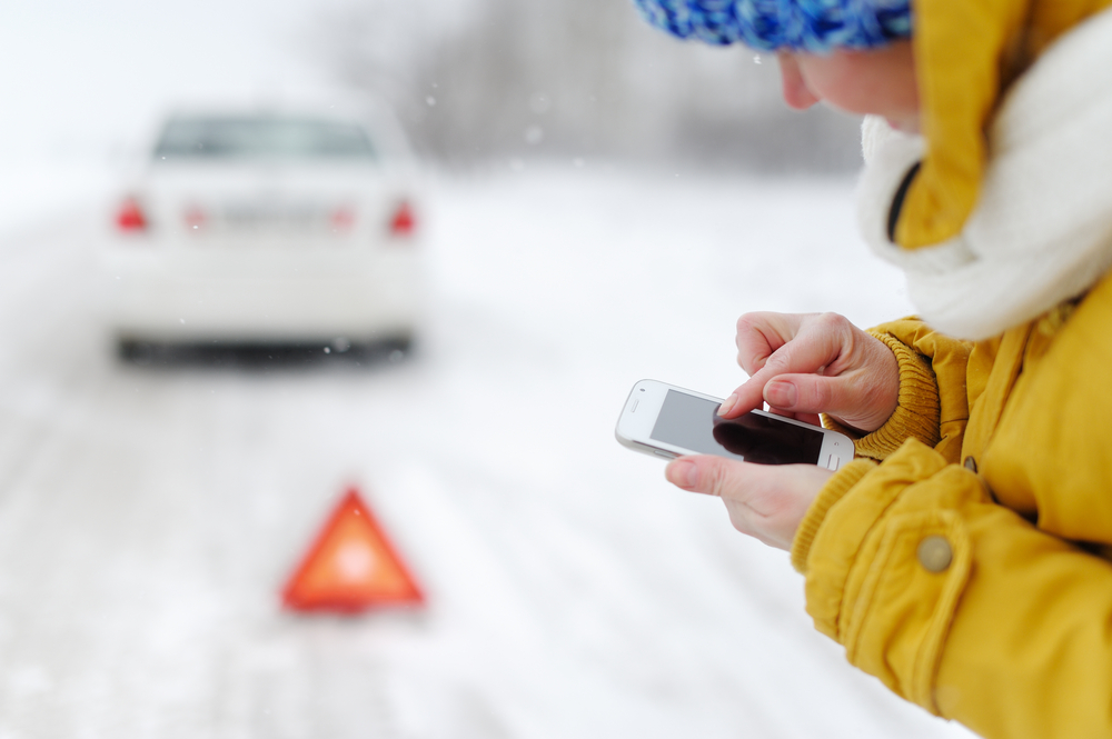 Assistance in Iceland winter. Women calling for assistance in the snow in Iceland.