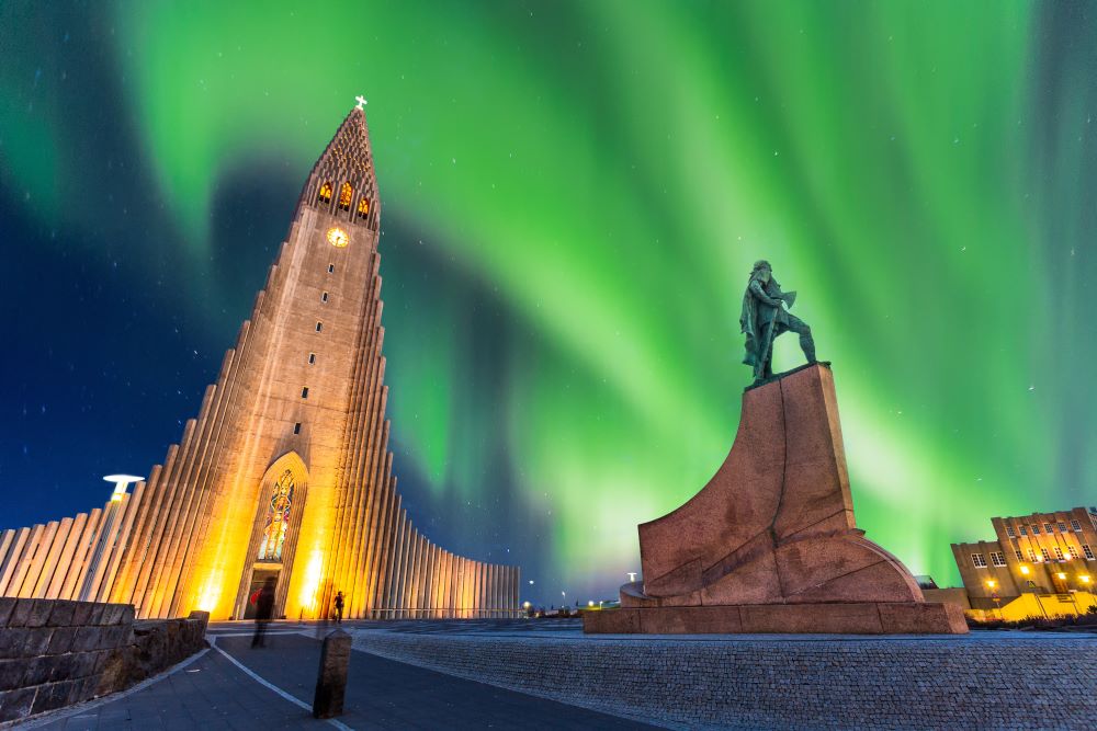 Hallgrímskirkja church in Reykjavik with the northern lights above.