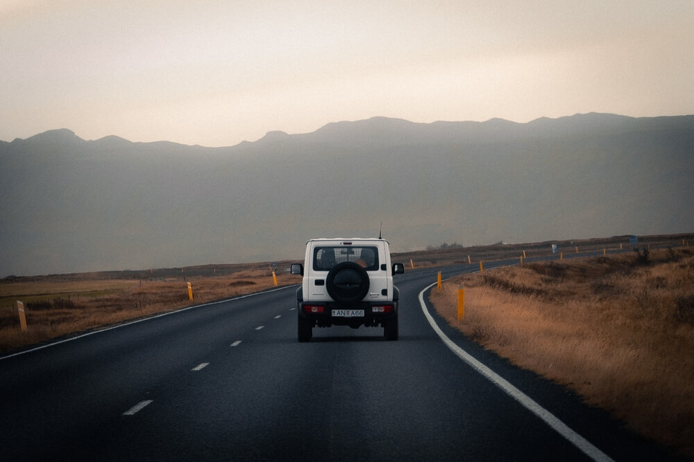 Suzuki Jimny 4x4 on a road in Iceland.