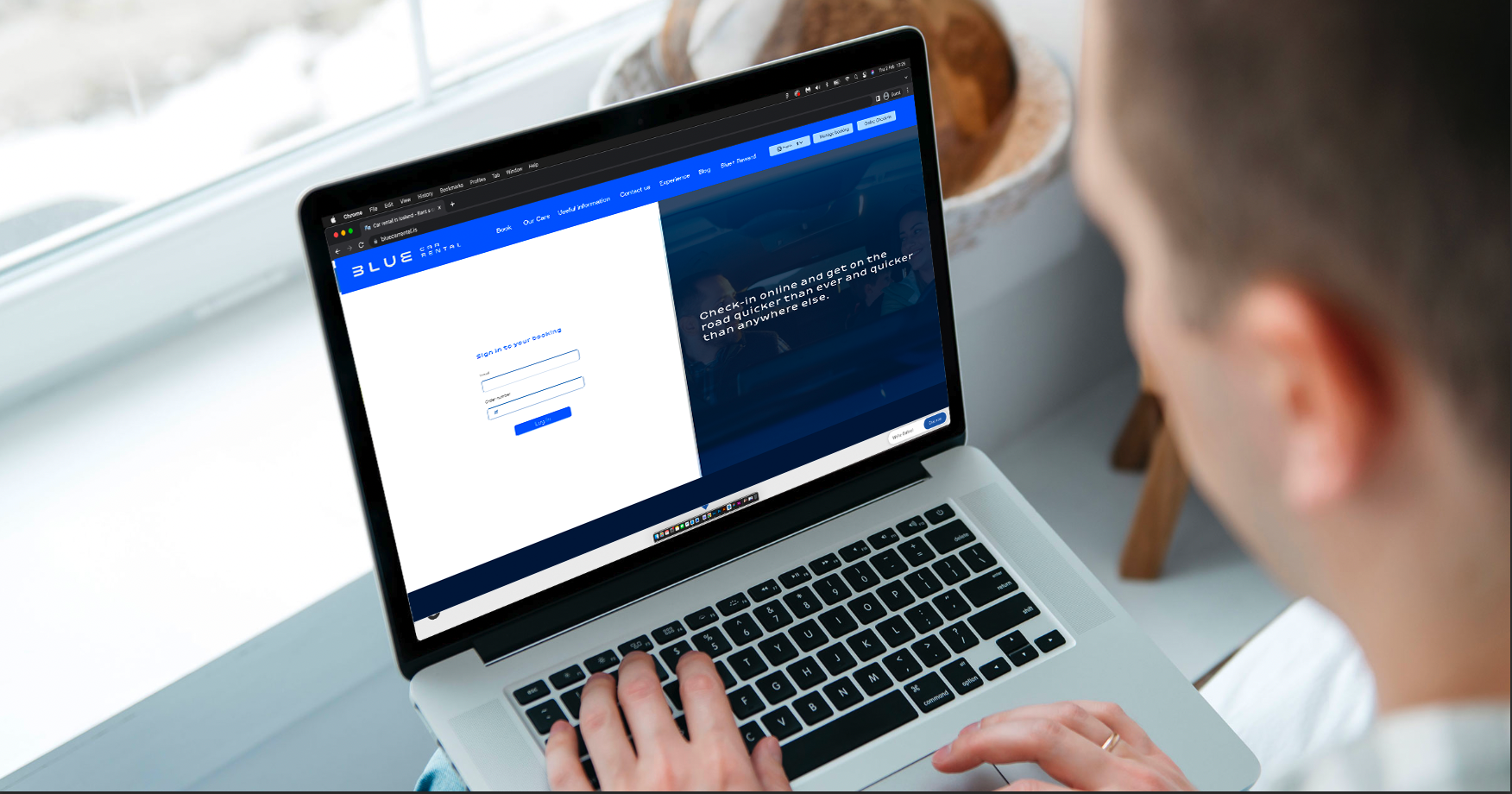 Blue car rental online service. Computer screen with Blue Car rental info.